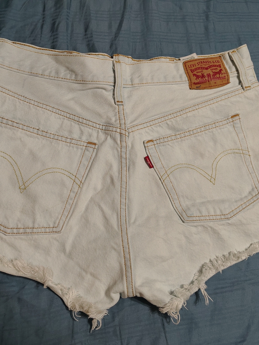 Levi's White Denim Cutoff Shorts with Frayed Hem